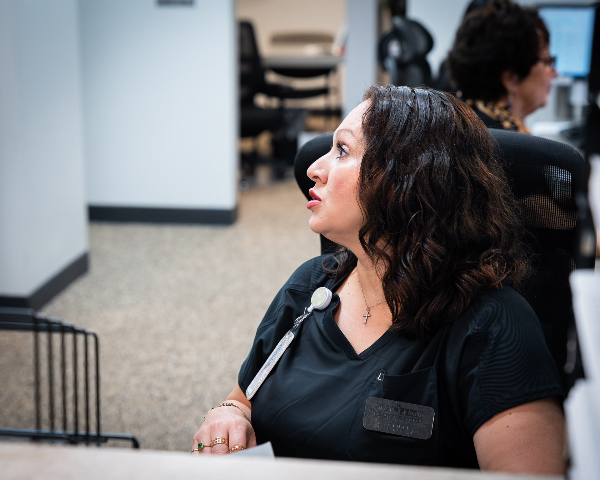 Medical assistant at work in the First Health front office